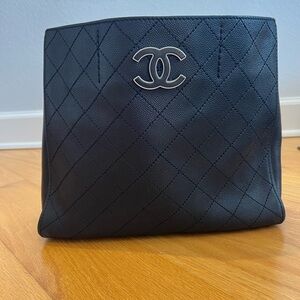 CHANEL Black Quilted Leather Bag with Silver Logo